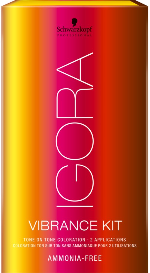 En låda med ljusgula och röda färger, innehållande Schwarzkopf Igora Vibrance Kit för hårfärg.