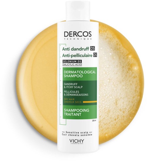 A white shampoo bottle with green and black text is placed on a yellow sponge, indicating a dandruff and scalp treatment.