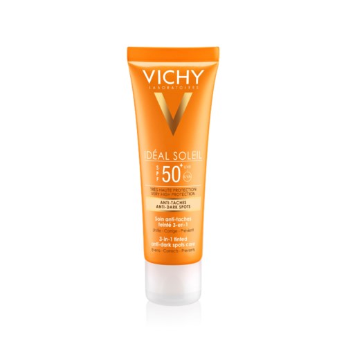 En ljus orange tub med Vichy Ideal Soleil solkräm med SPF 50, för solskydd och mot mörka fläckar.