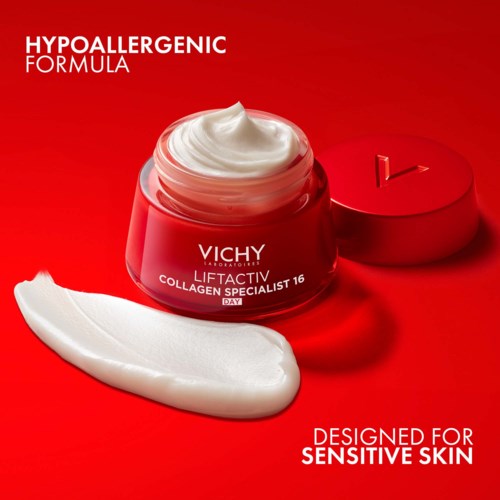 A red jar of Vichy skincare cream with white text, an open lid, and a dollop of cream on a red background.
