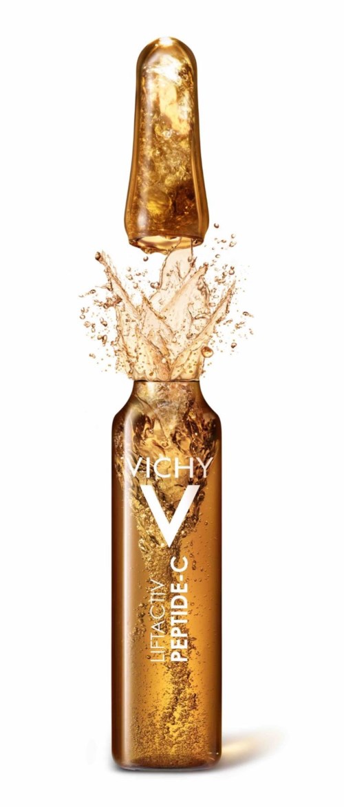 Eine goldene Flasche mit Flüssigkeitssplash und den Text 'VICHY' und 'LIFACTIV PEPTIDE-C'.