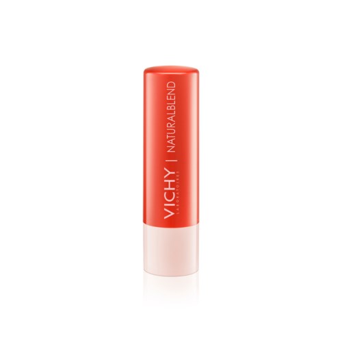 A red and white tube of Vichy lip balm with the text 'NATURALBLEND' on it.