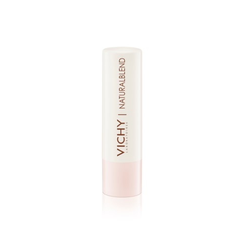 A white cylindrical tube with pink at the bottom, labeled 'VICHY NATURALBLEND' in brown and red.