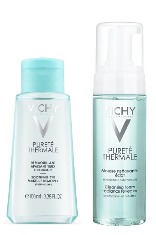 Two skincare products, one for makeup removal and one cleansing foam, in light blue bottles with white caps.
