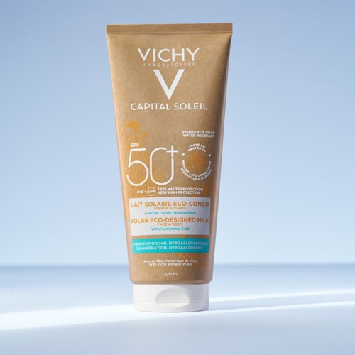 A tube of Vichy Capital Soleil sunscreen with SPF 50+ standing upright on a light surface.