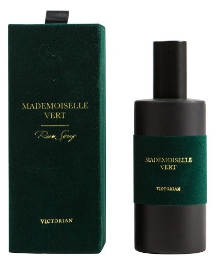 A dark green box and a black bottle with a green label. The box and bottle display gold text for branding.