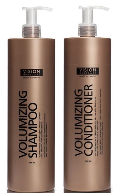 Two bottles, one for shampoo and one for conditioner, with pump dispensers and matching beige packaging.