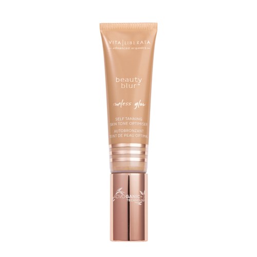 En tub med bustillbehörsolja i rosa färg med ett glänsande lock, märkt "Beauty Blur" av Vita Liberata.