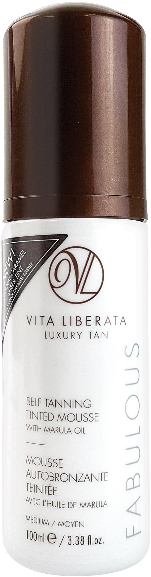 En vit flaska med brun kork, märkt 'VITA LIBERATA' och 'LUXURY TAN' för självvårdsmousse.
