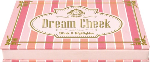 Pink and white striped box with gold accents, labeled 'Dream Cheek' and 'Blush & Huckleberry'.