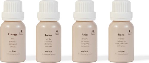Four small bottles labeled Energy, Focus, Relax, and Sleep with natural ingredients for well-being.