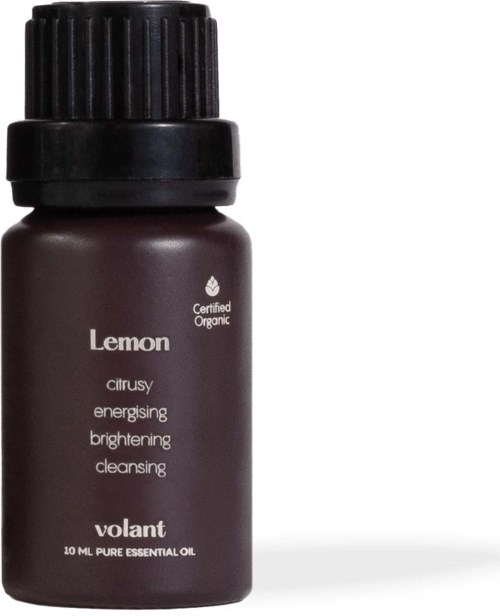 A small dark brown bottle labeled Lemon with a black cap, contains essential oil for skin and energy benefits.
