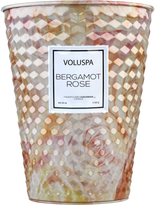 En dekorativ ljuslykta i ett texturerat, glänsande behållare, märkt 'Voluspa Bergamot Rose', med rosa och krämfärger.