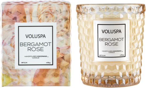 En doftljus med blommönster i ett mönstrat glas och en matchande box, märkt Bergamot Rose.