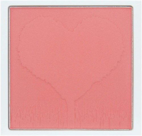 A pink makeup blush with a heart-shaped imprint in the center.