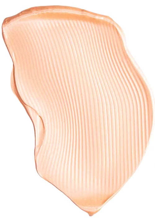 A smear of beige-colored cream with fine lines, shaped irregularly on a white background.