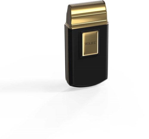 A small black and gold electric shaver with a gold blade and a black body.