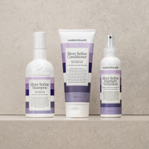 Tre hårvårdsprodukter från Waterclouds: schampo, balsam och behandling, alla märkta 'Silver Refine'.