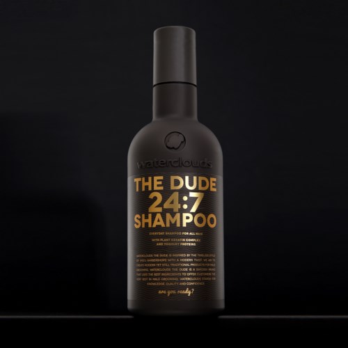 A black bottle labeled 'The Dude 24:7 Shampoo' with gold and orange text, standing against a black background.