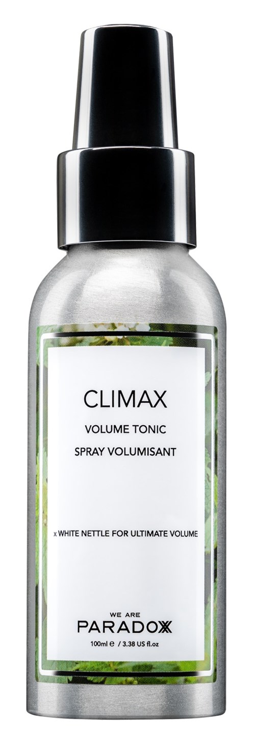 En silver sprayflaska märkt Climax Volume Tonic med svart lock, troligtvis för hår. Märke: Paradox.