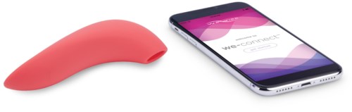 A pink silicone device next to a smartphone displaying 'We-Connect' on the screen.