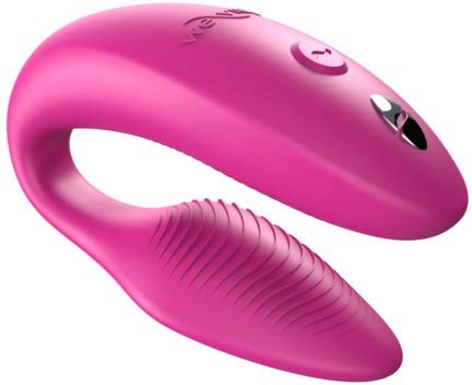 A pink, curved gadget with buttons and a textured grip, possibly a personal massager or electronic device.