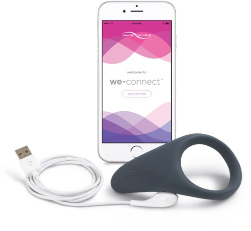 A smartphone with a pink and purple app screen, a USB charger, and a curved black device.