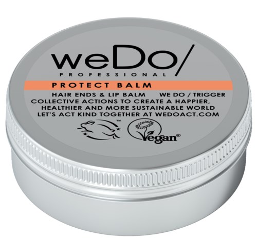 En rund beholder merket 'weDo ProfessionalProtect Balm' for hår- og leppepleie, med vegan og handlingstrigger detaljer.