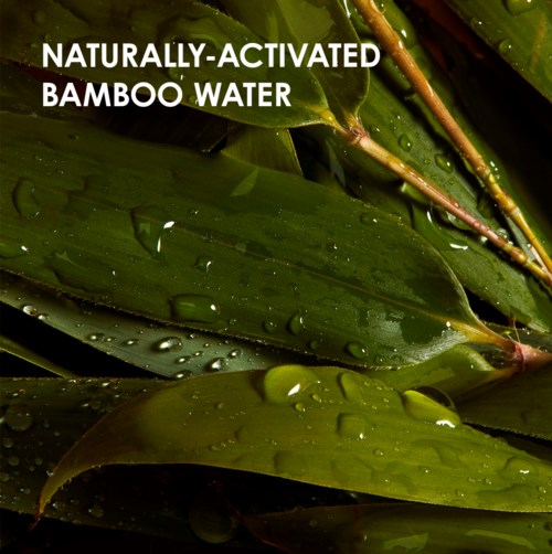 Grønne bambusblader med vanndråper og teksten 'NATURALLY-ACTIVATED BAMBOO WATER' øverst.