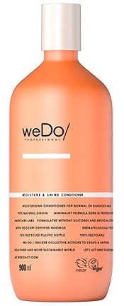 En ferskenfarget flaske med hvit kork, merket 'weDo' og 'Moisture & Shine Conditioner'.