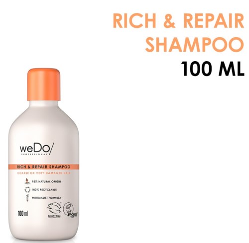 En hvit flaske med oransje lokk merket 'Rich & Repair Shampoo' for skadet hår, 100ml, cruelty-free og resirkulerbar.