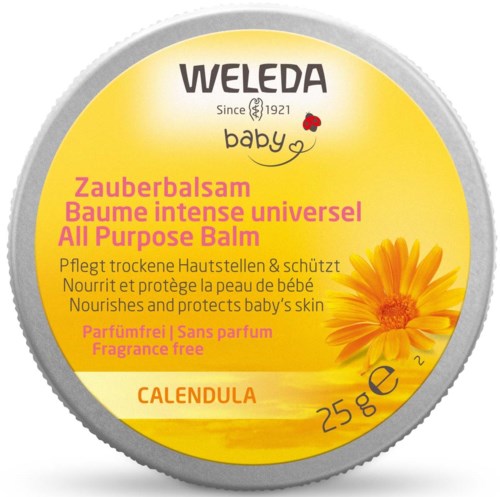 En lysende gul metallkapsel for Weleda babyolje med blomsterbilde og produktdetaljer på flere språk.
