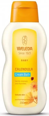 A bottle of Weleda Baby Calendula Cream Bath, with orange cap and yellow label, used for gentle skin cleansing.