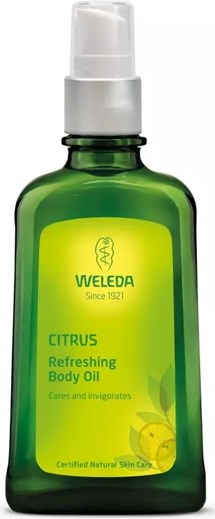 Vihreä pullo Weleda Citrus Refreshing Body Oil, jossa valkoinen suutin, luonnollista ihonhoitoa.