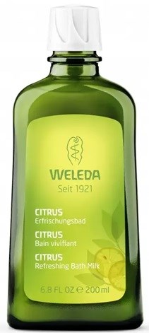 Grüne Flasche von Weleda Citrus Erfrischendes Bade Milk mit weißem Deckel, Etikett mit Zitrone und Baum.