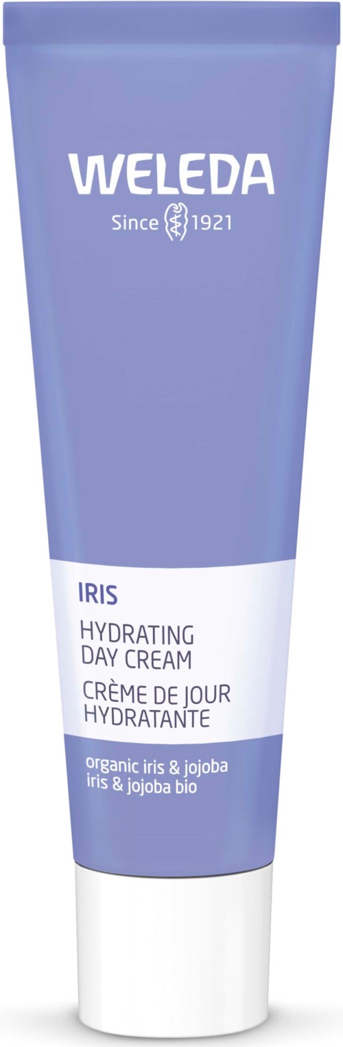 A blue tube of Weleda Iris Hydrating Day Cream with white and purple text, mentioning organic iris and jojoba.