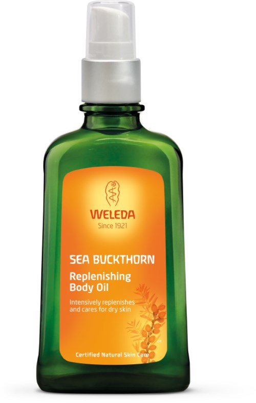Green bottle with a white pump, orange label, and a sea buckthorn illustration. It is for body oil to hydrate dry skin.