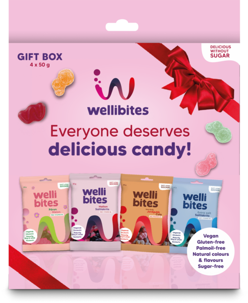 A pink gift box package with Wellibites candies, colorful packaging, and a red bow, promoting sugar-free, vegan, and gluten-free treats.