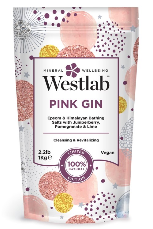 Förpackningen är rosa med färgglada cirklar och stjärnor. Den är för badsalt Pink Gin av Westlab.