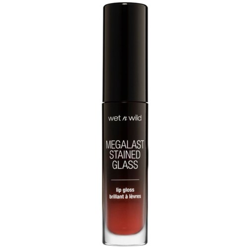 Musta putkilossa näkyy punainen huulikiilto, merkitty 'wet n wild MEGALAST STAINED GLASS' ja 'lip gloss'.
