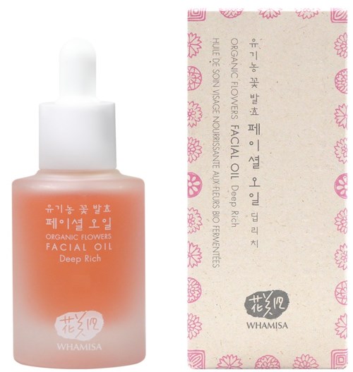 Ihonhoitotuote nimeltä 'Organic Flowers Facial Oil Deep Rich' Whamise:lta, vaaleanpunainen pullo ja pinkkikukkakuvioinen etiketti.