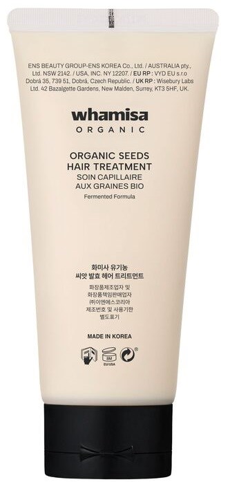 Whamisa Organic Seeds Hair Treatment valkoisessa putkilossa mustalla kannessa, tekstiä koreaksi ja englanniksi.