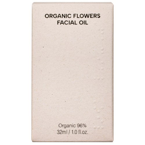 Eske med tekst om organisk blomster ansiktsolje, som indikerer naturlige ingredienser og 32 ml størrelse.