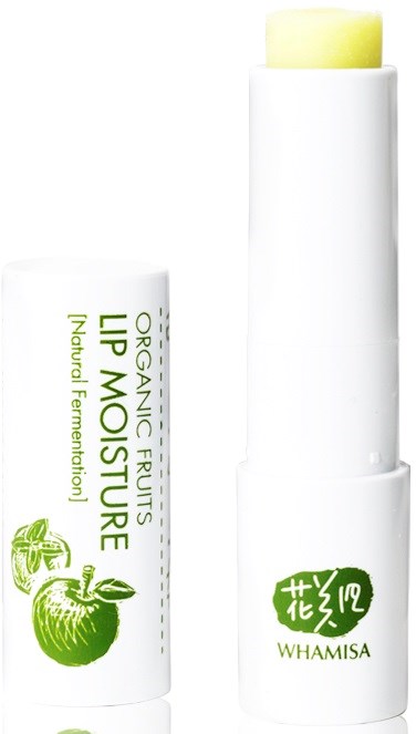 En vit stift med gröna texter och ett äpple. Den är märkt "Lip Moisture" och "Whamisa."
