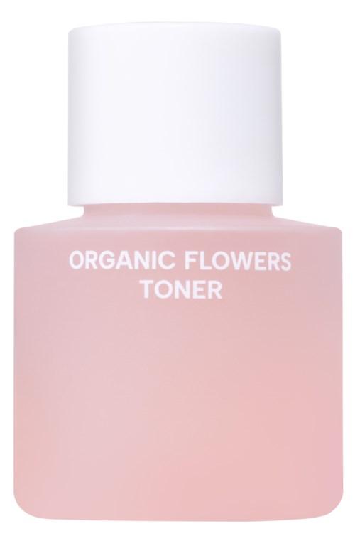 Różowa butelka z napisem 'Organic Flowers Toner', prosty design z białą zakrętką.