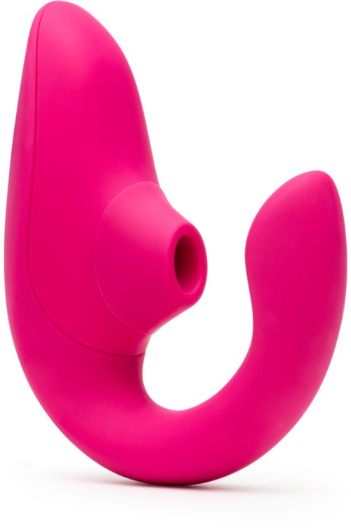 En rosa, böjd enhet med ett hål i mitten, troligen en personlig massager eller vuxenleksak.