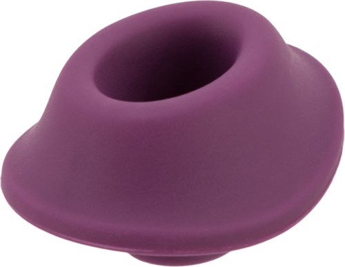 Ett lila silikonföremål med ett hål i mitten, formad som en donut. Det verkar vara mjukt och flexibelt.