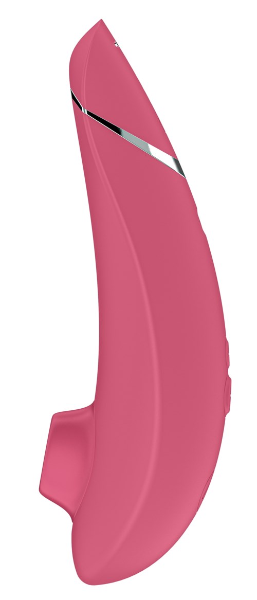 A pink curved object with a black and white stripe, looks like a cutting tool or gadget.