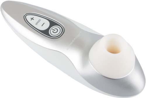 En liten vit enhet med kontrollpanel, plus ett mjukt, runt fäste för massage eller ansiktsbehandling.