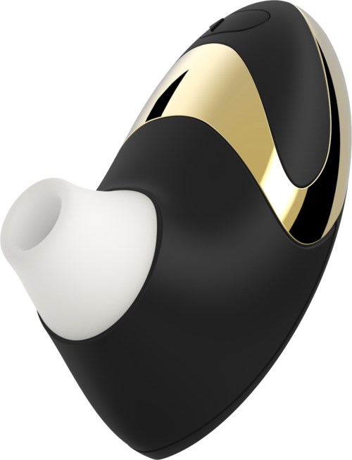 En liten, svart och guld trådlös hörapparat med en vit öronpropp. Kompakt och elegant design.